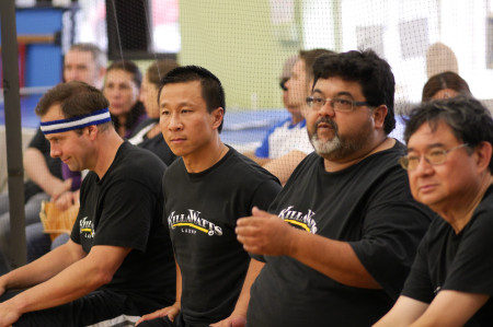 Killawatts (Roger Boden, Tom Nguyen, Paul Sierra, and Paul Pau) watch the action from their team bench