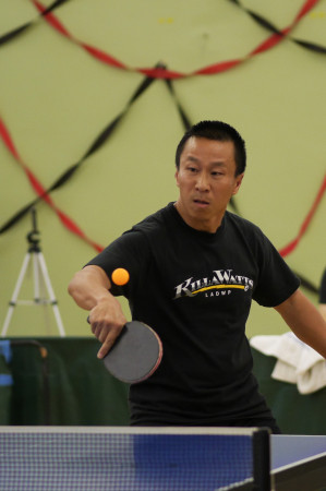 Tom Nguyen sets up to flip a backhand winner
