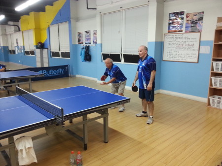 Sam and Victor serving in doubles