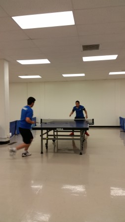 Alex Marquez gets ready to return a strong backhand loop from Arman Ak
